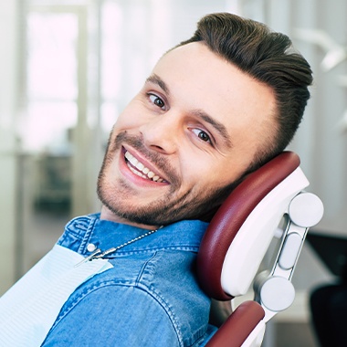 Man in dental chair for root canal therapy