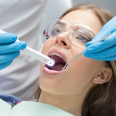 Dentist using intraoral camera to capture smile images