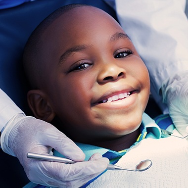 Child receiving dental checkup