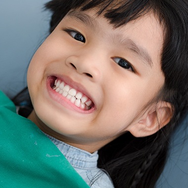 Child smiling after receiving dental sealants