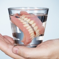 Full denture in glass of water