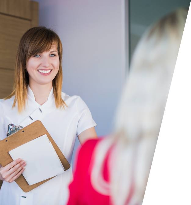 Dental team member collecting dental insurance forms