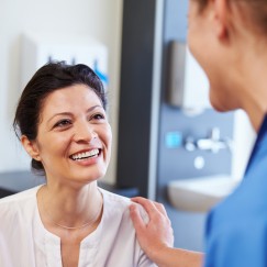 Dental patient smiling at dentist