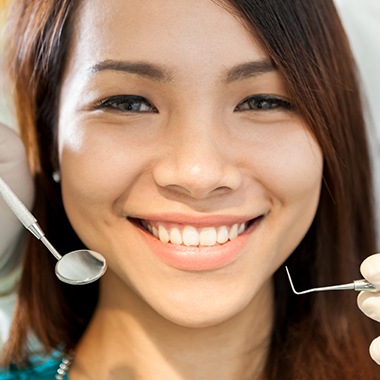 Young woman smiling during dental checkup