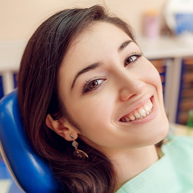 Woman smiling after wisdom tooth extraction