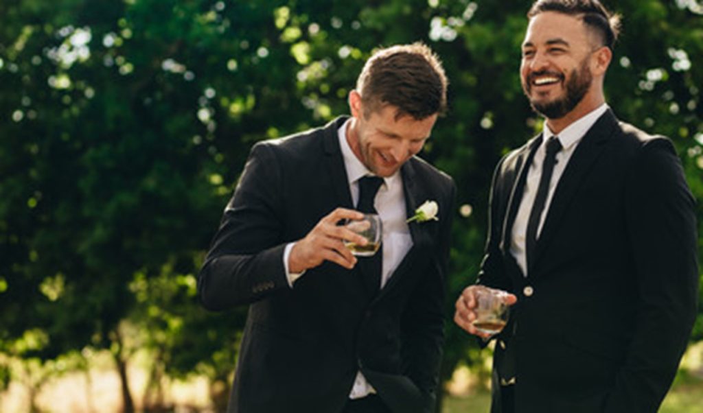 Guests smiling at a wedding.