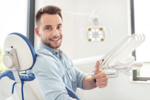 Man at the dentist for root canal therapy.